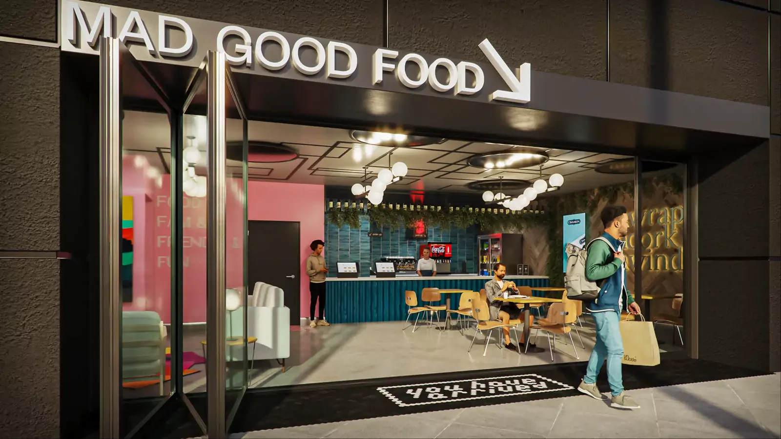 Unsubtle storefront at night with a Mad Good Food sign over the entrance